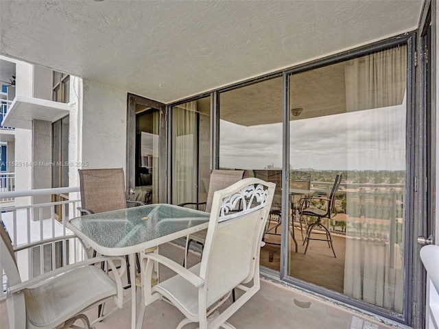 balcony with outdoor dining area