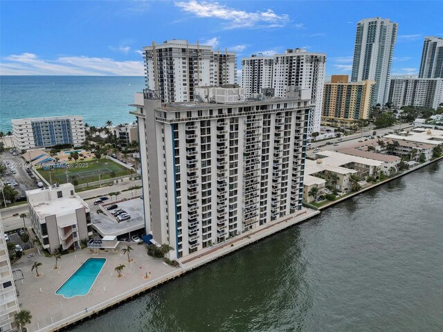 birds eye view of property with a water view