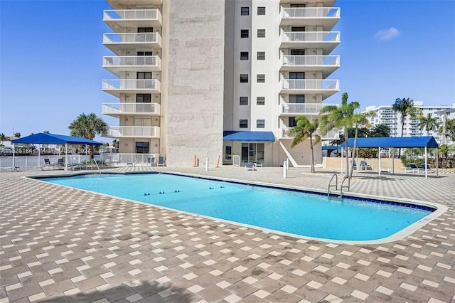 view of swimming pool with a patio