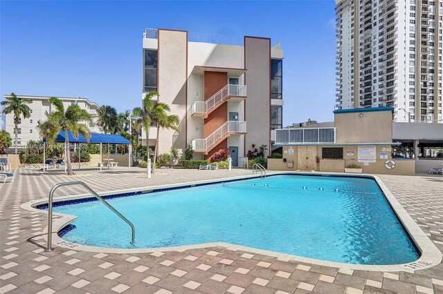 view of swimming pool with a patio area