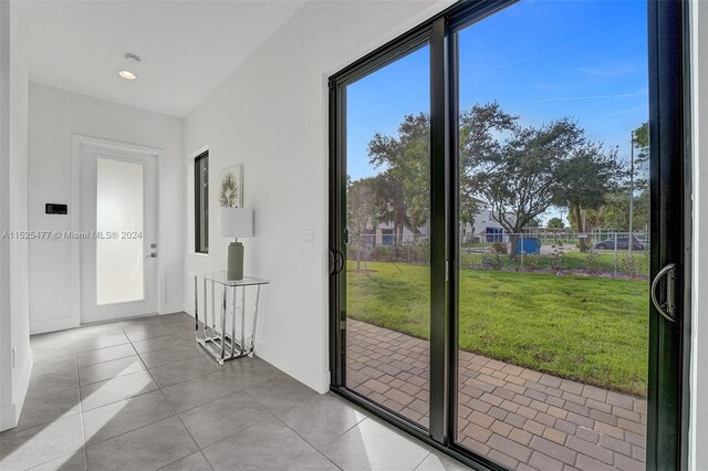 entryway with light tile flooring