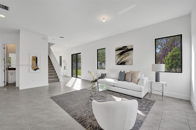 living room featuring light tile floors