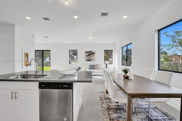 kitchen with dishwasher, visible vents, plenty of natural light, and a sink