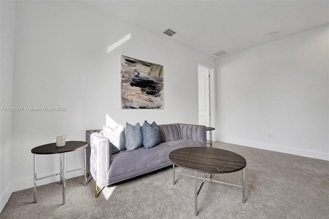 living area featuring visible vents, carpet flooring, and baseboards