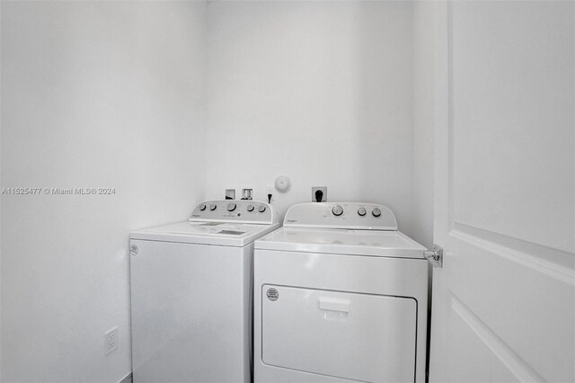 washroom featuring hookup for an electric dryer, washer and dryer, and hookup for a washing machine