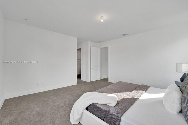 bedroom with dark carpet