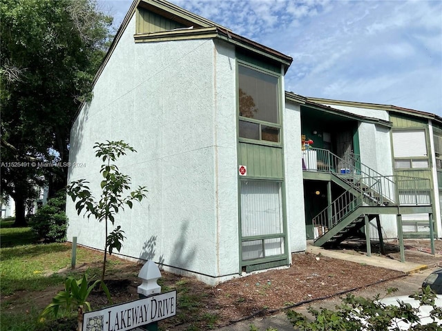 view of side of property with a balcony