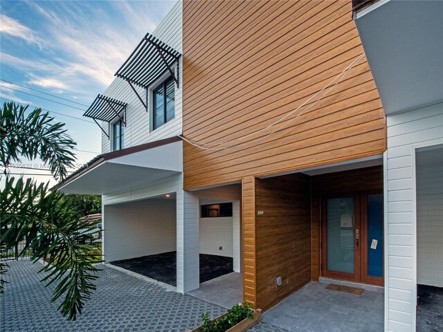 view of side of home featuring a garage