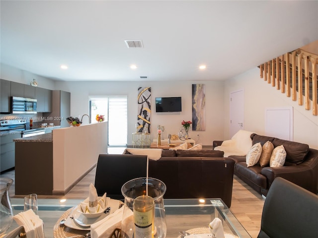 living room with light hardwood / wood-style floors