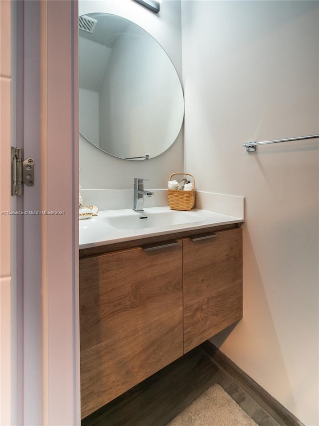 bathroom featuring hardwood / wood-style floors and vanity