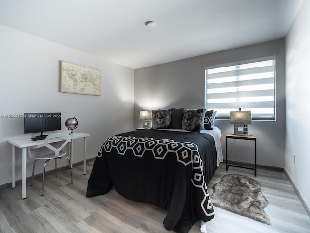 bedroom with light wood-type flooring