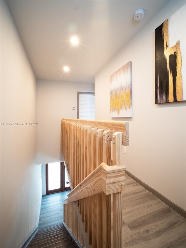 hallway with dark wood-type flooring