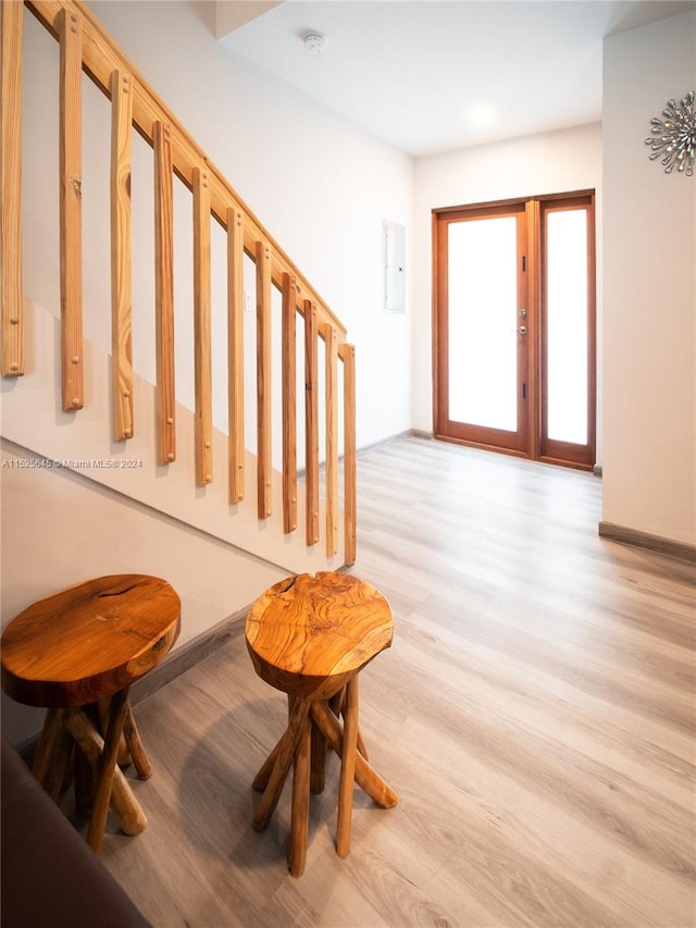 stairs with light wood-type flooring