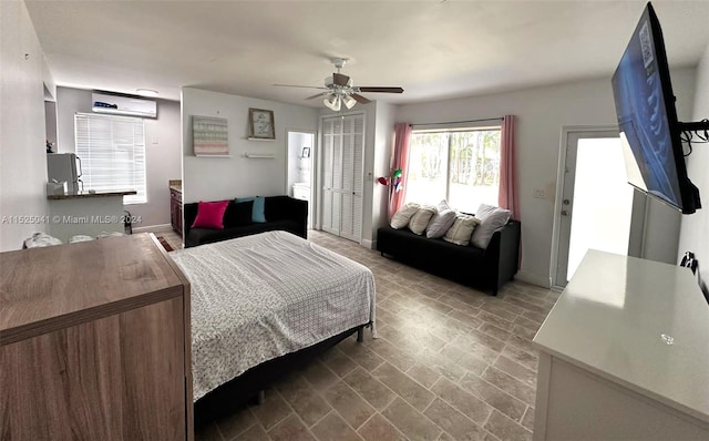 tiled bedroom featuring a closet and ceiling fan