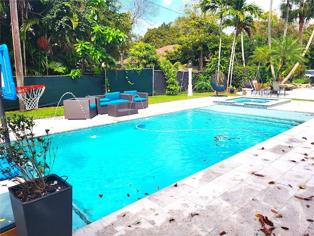 view of pool featuring a patio area, an in ground hot tub, and an outdoor living space