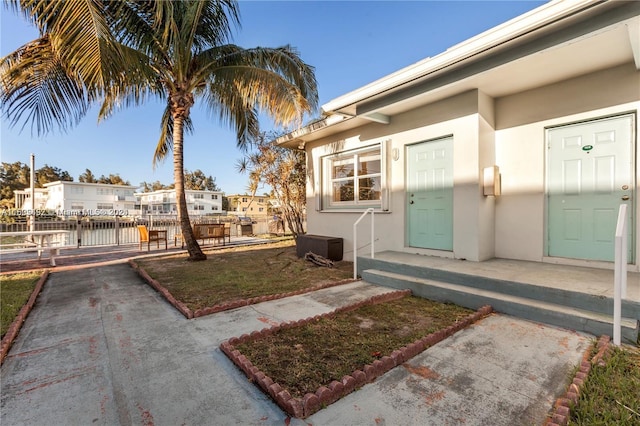 entrance to property with a water view