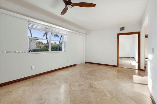 empty room featuring ceiling fan