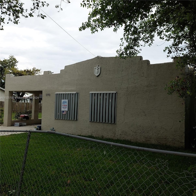 rear view of house with a yard