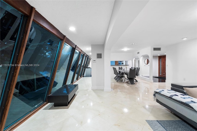 hallway featuring light tile floors