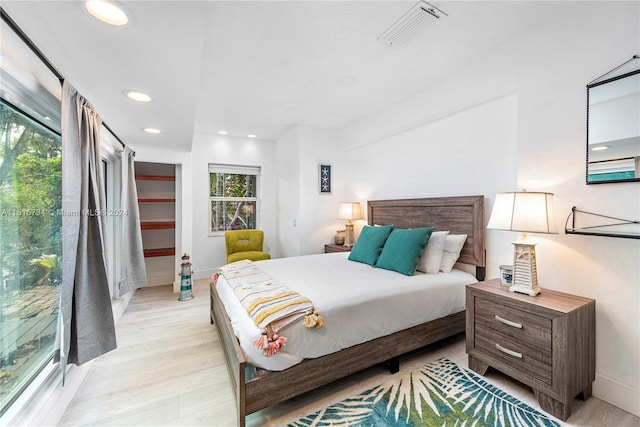 bedroom with light hardwood / wood-style flooring