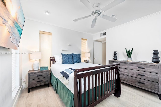 bedroom with ceiling fan, ornamental molding, and light hardwood / wood-style flooring