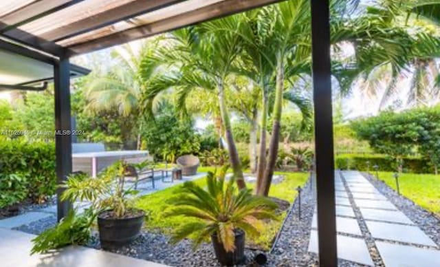 view of home's community with a patio area