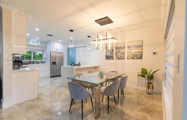 dining space featuring light tile flooring and crown molding