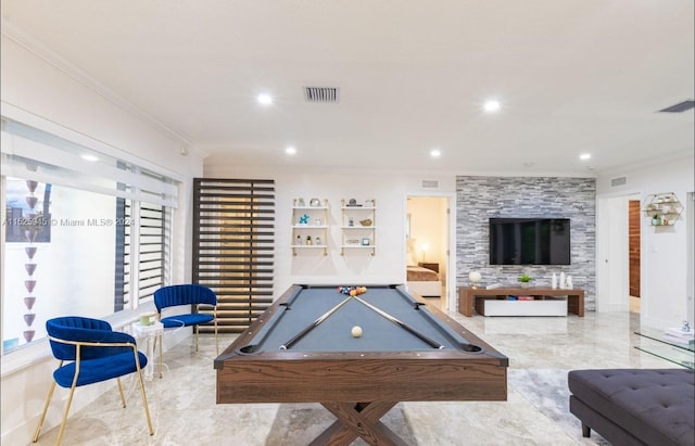 game room featuring light tile floors, ornamental molding, a large fireplace, and pool table