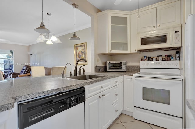 kitchen featuring pendant lighting, white appliances, light tile flooring, sink, and a notable chandelier