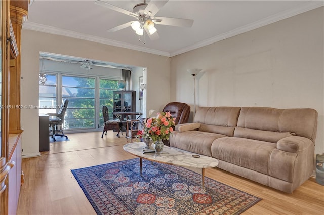 living room with light hardwood / wood-style flooring, crown molding, and ceiling fan