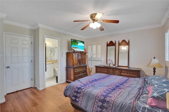 bedroom featuring ceiling fan, ensuite bathroom, light wood-type flooring, and crown molding