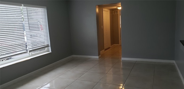 empty room with tile patterned floors