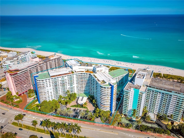 aerial view with a beach view and a water view