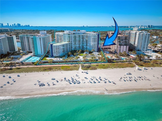 bird's eye view with a beach view and a water view