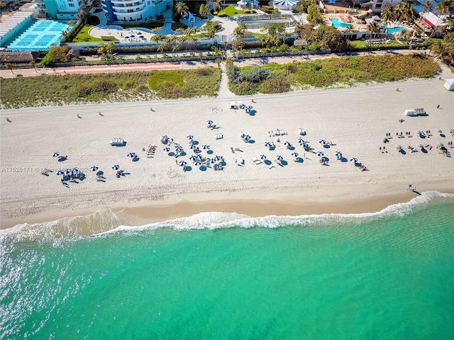 bird's eye view featuring a beach view and a water view