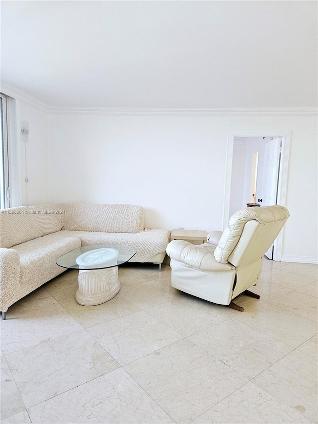 living room with ornamental molding and light tile floors