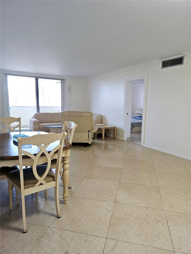 tiled dining space with crown molding