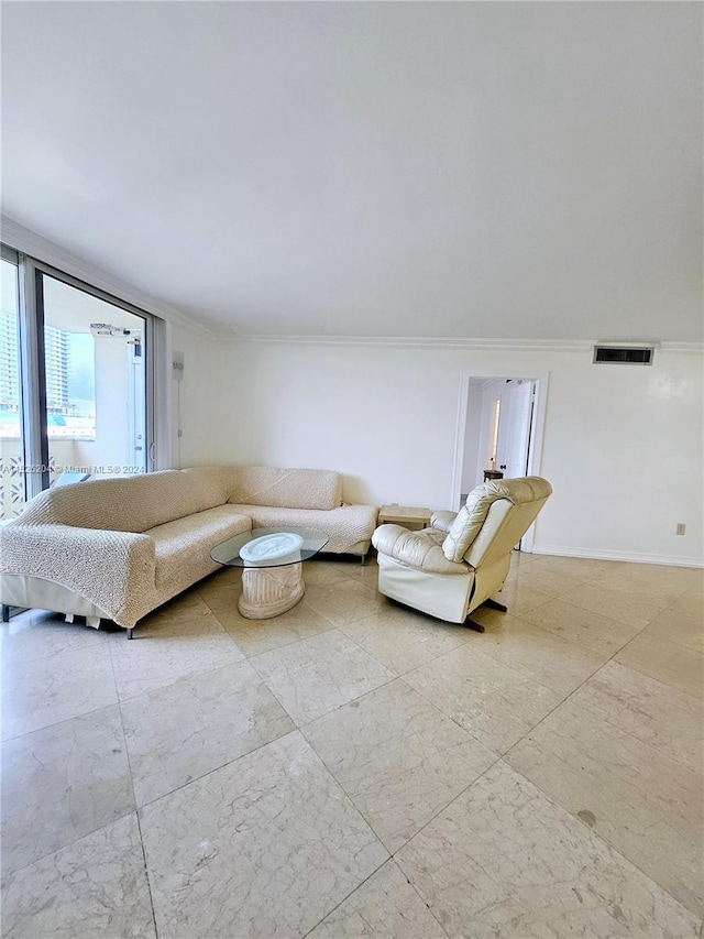 unfurnished living room featuring light tile flooring and ornamental molding