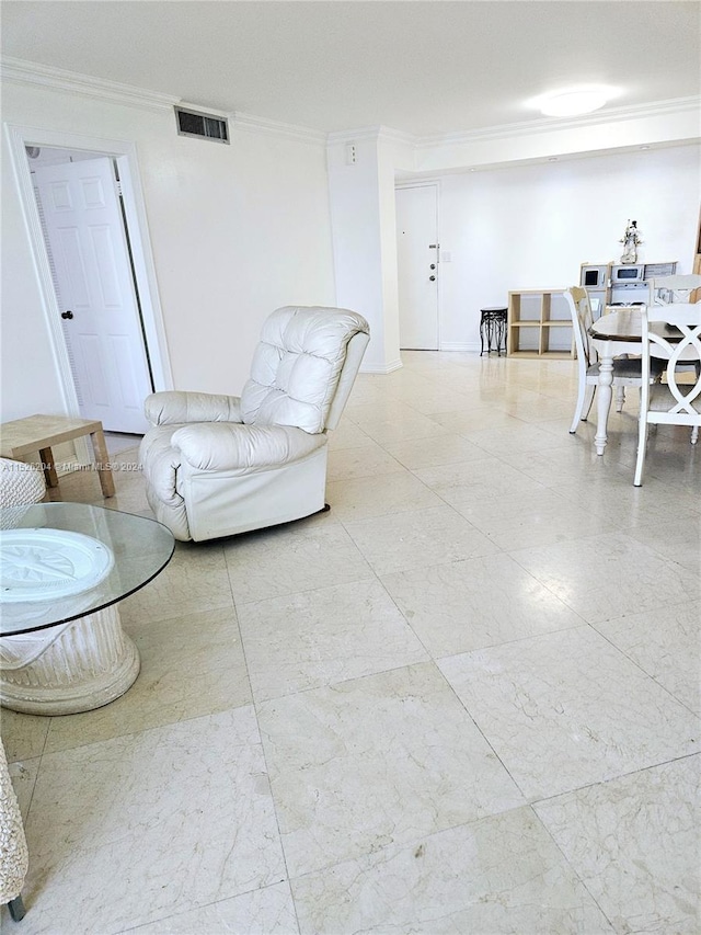 living room with light tile floors and ornamental molding