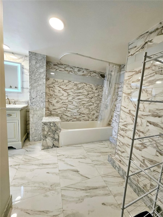 bathroom with tile floors, large vanity, tile walls, and tub / shower combination