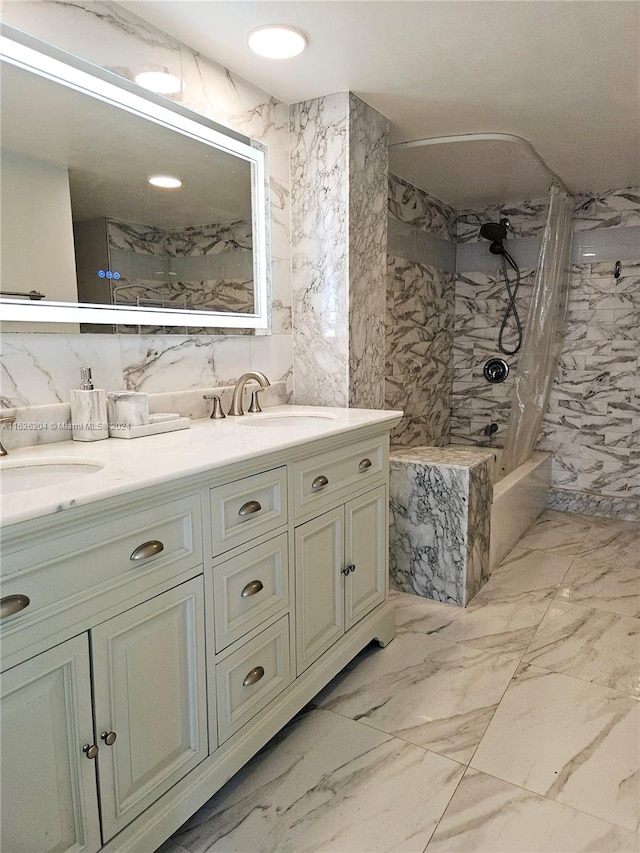 bathroom with tiled shower / bath combo, tile walls, tile floors, dual sinks, and large vanity