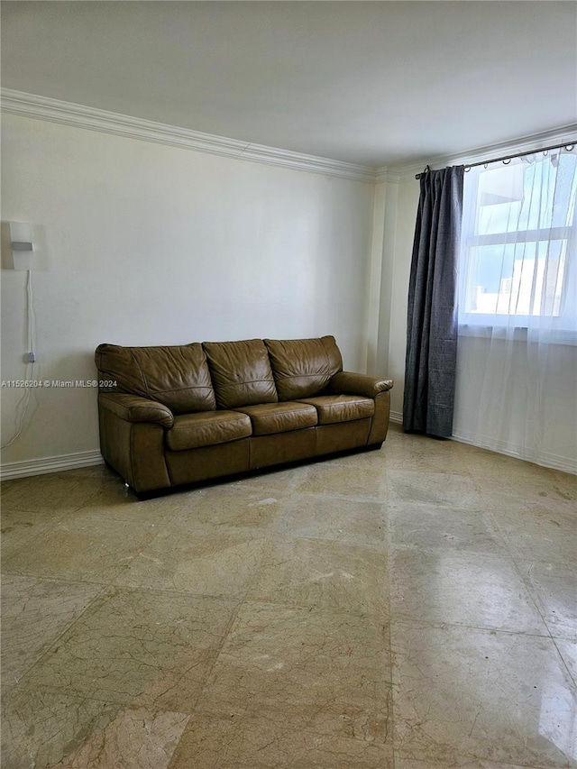 unfurnished living room with ornamental molding and light tile floors