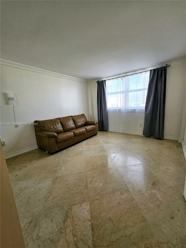 unfurnished living room featuring ornamental molding and light tile floors