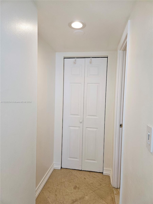 corridor with light tile floors