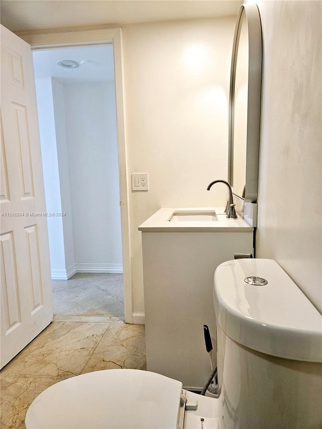 bathroom featuring tile floors and sink