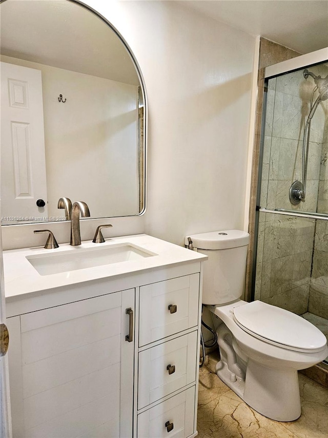 bathroom with toilet, tile floors, a shower with shower door, and oversized vanity