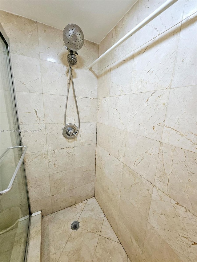 bathroom with tiled shower