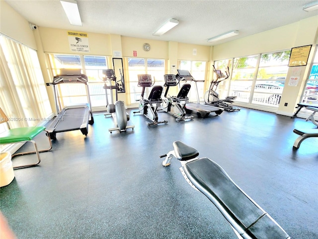 gym with a textured ceiling