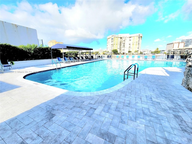 view of swimming pool featuring a patio