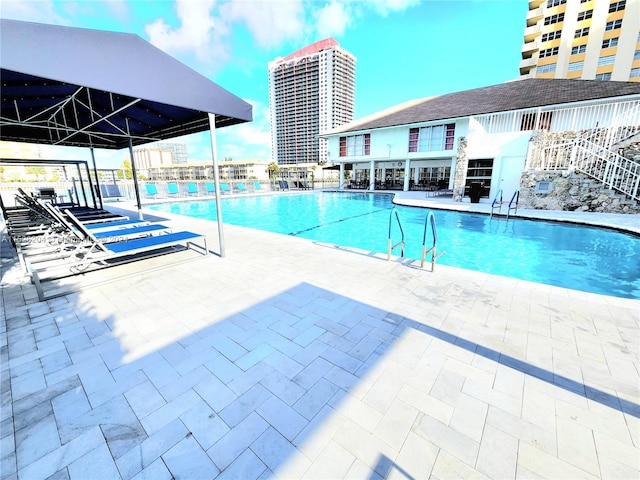 view of swimming pool featuring a patio